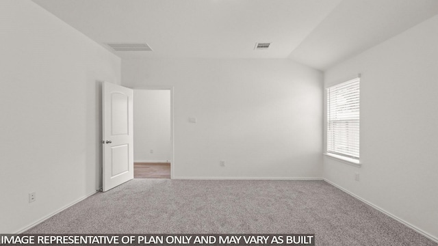 1342 Heather Rosewood Ln, Conroe, TX 77301 - carpeted empty room featuring vaulted ceiling and baseboards