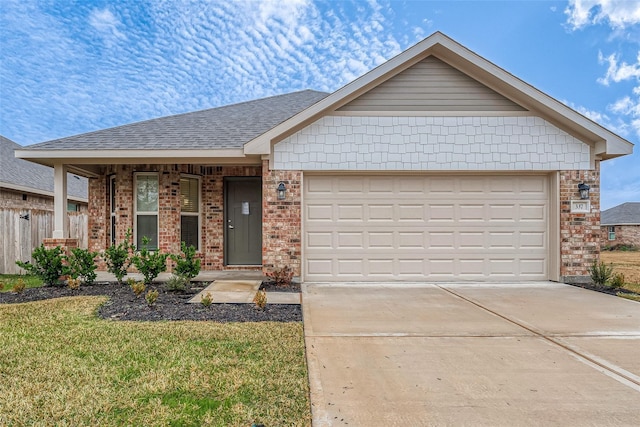 23 Greenbriar Loop, Angleton, TX 77515 - single story home with a garage, concrete driveway, a front yard, brick siding, and a shingled roof