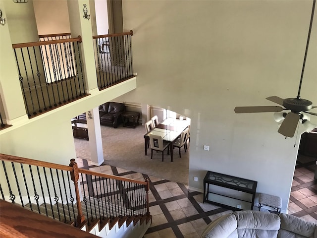 8007 Furleson Dr, Rosenberg, TX 77469 - living room featuring a towering ceiling, carpet, baseboards, and ceiling fan
