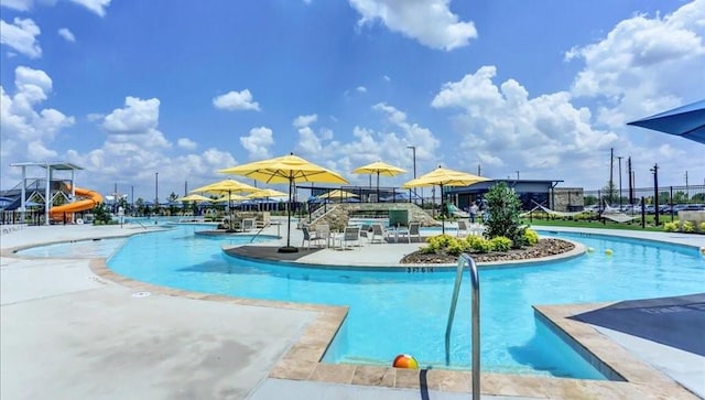 2916 Apple Rose, Katy, TX 77493 - pool with a water slide, fence, and a patio