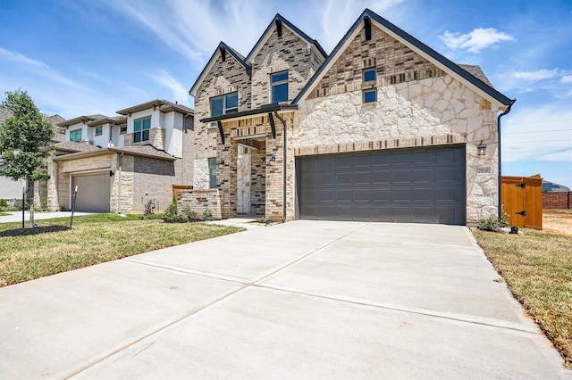 2916 Apple Rose, Katy, TX 77493 - view of front of house with a front lawn, driveway, stone siding, and a garage