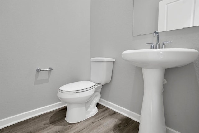 2916 Apple Rose, Katy, TX 77493 - half bath featuring toilet, wood finished floors, and baseboards