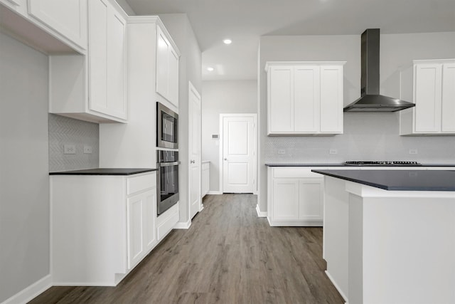 2916 Apple Rose, Katy, TX 77493 - kitchen featuring dark countertops, wall chimney exhaust hood, appliances with stainless steel finishes, and backsplash