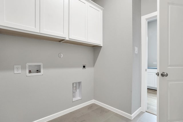 2916 Apple Rose, Katy, TX 77493 - laundry room with hookup for an electric dryer, hookup for a gas dryer, hookup for a washing machine, baseboards, and cabinet space