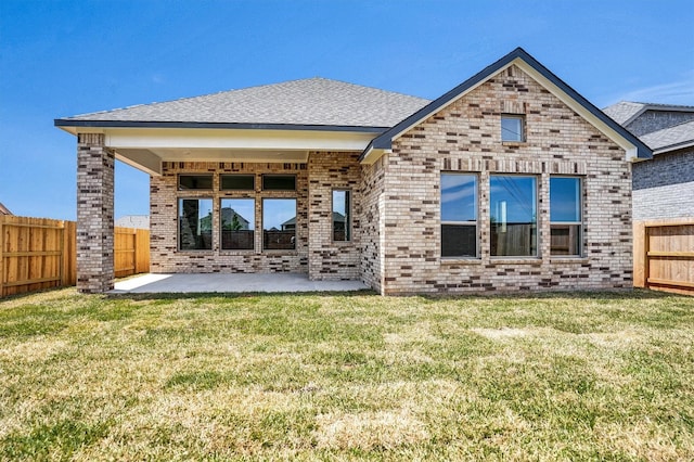 2916 Apple Rose, Katy, TX 77493 - back of house with a fenced backyard, brick siding, and a patio area