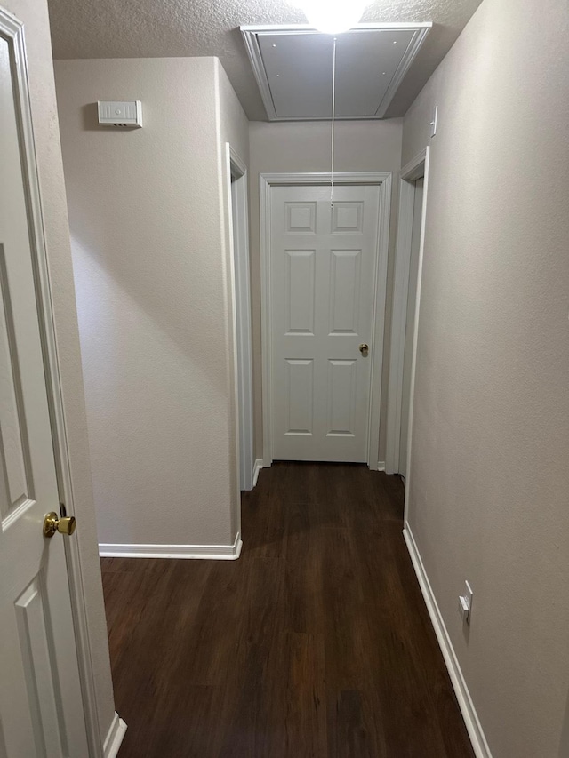 14434 Glade Point Dr, Cypress, TX 77429 - hall with attic access and dark wood-type flooring
