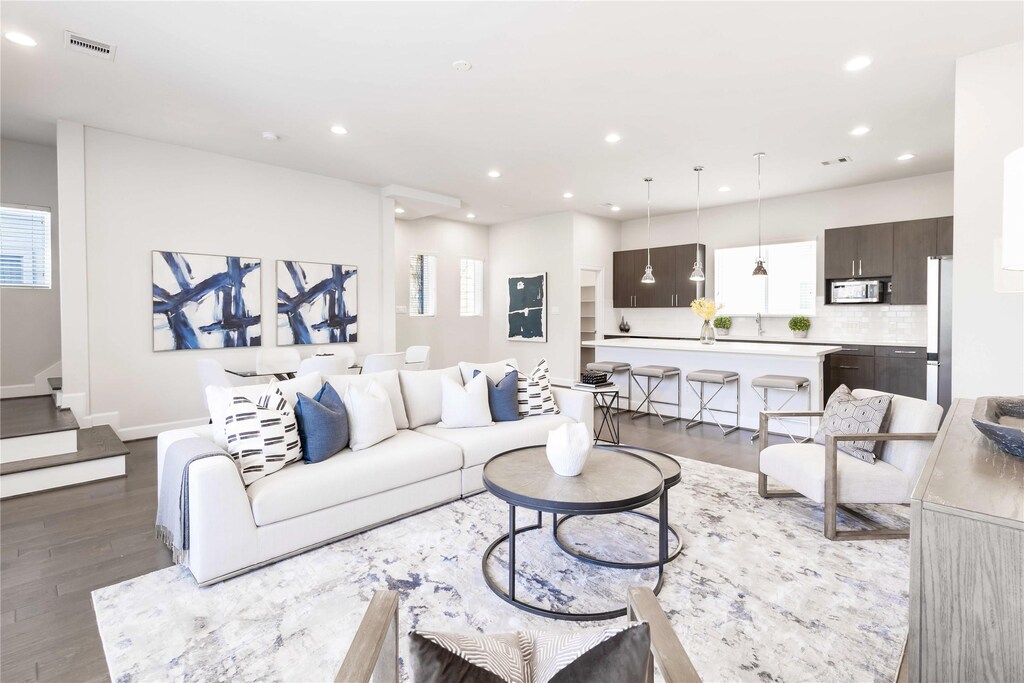 1507 Elgin St, Houston, TX 77004 - living room with stairway, recessed lighting, baseboards, visible vents, and wood finished floors