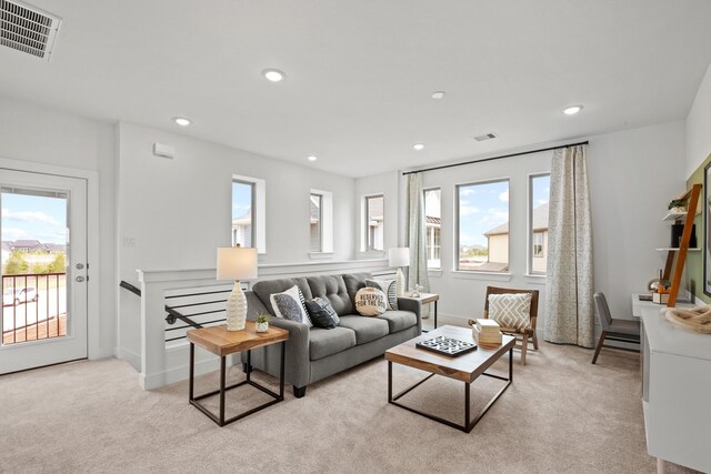 15850 Invergelder Dr, Atascocita, TX 77346 - living room with recessed lighting, visible vents, light colored carpet, and baseboards