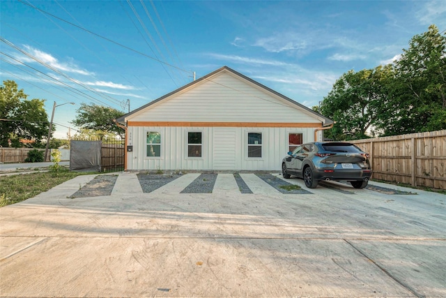 garage with a gate and fence