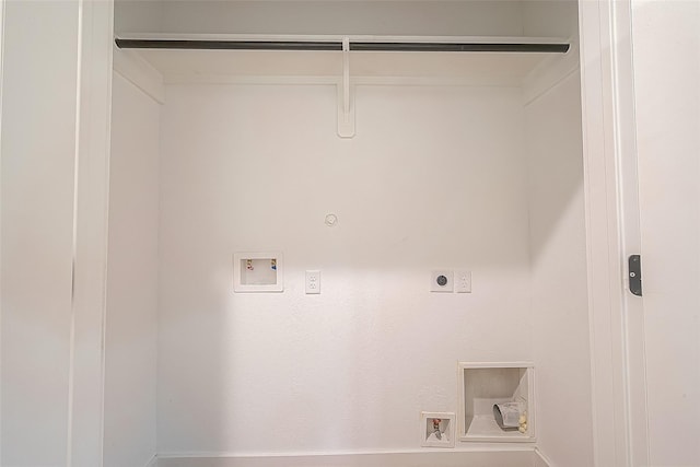 clothes washing area with washer hookup, hookup for an electric dryer, laundry area, and hookup for a gas dryer