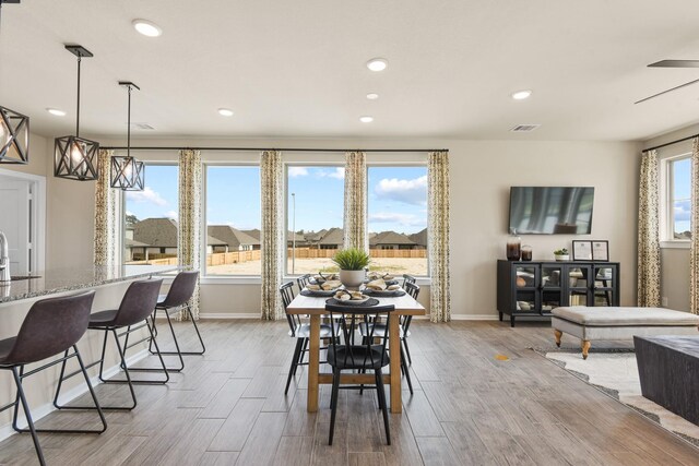 15854 Invergelder Dr, Atascocita, TX 77346 - dining room with baseboards, light wood-style floors, and recessed lighting