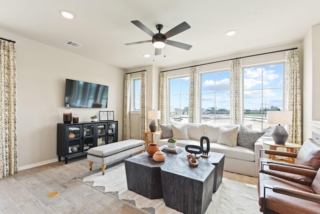 15854 Invergelder Dr, Atascocita, TX 77346 - living area with light wood finished floors, a ceiling fan, baseboards, and recessed lighting