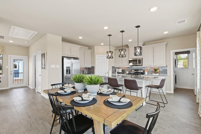 15854 Invergelder Dr, Atascocita, TX 77346 - dining area with baseboards, recessed lighting, and light wood-style flooring