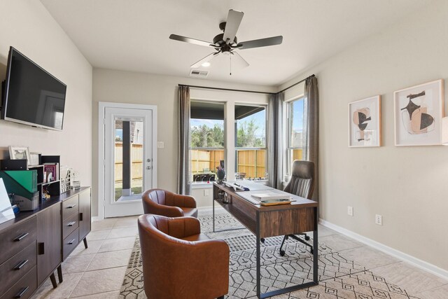 15854 Invergelder Dr, Atascocita, TX 77346 - home office featuring light tile patterned flooring, a ceiling fan, and baseboards