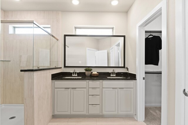 15854 Invergelder Dr, Atascocita, TX 77346 - bathroom featuring a shower stall, a spacious closet, double vanity, and recessed lighting