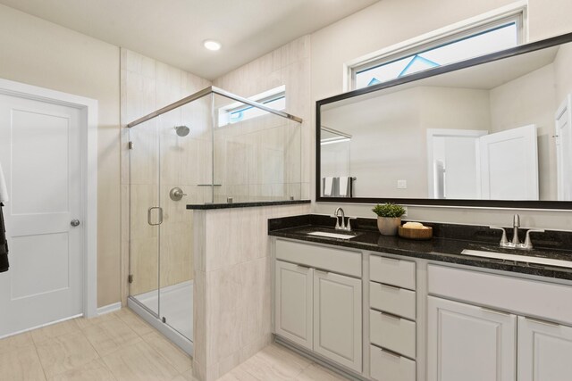 15854 Invergelder Dr, Atascocita, TX 77346 - bathroom with double vanity and a stall shower