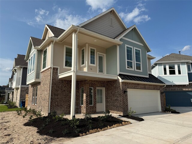 15854 Invergelder Dr, Atascocita, TX 77346 - view of front of house with brick siding, driveway, and a garage