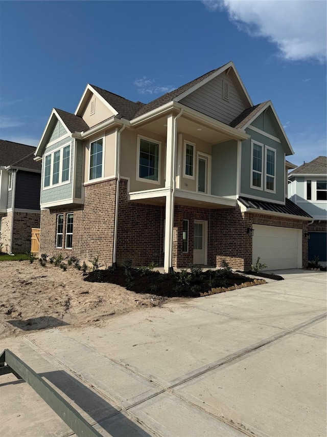 15854 Invergelder Dr, Atascocita, TX 77346 - view of front of house featuring a garage, brick siding, driveway, and stucco siding