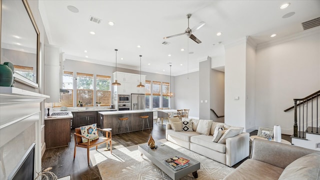 living room featuring recessed lighting, a ceiling fan, stairs, and visible vents