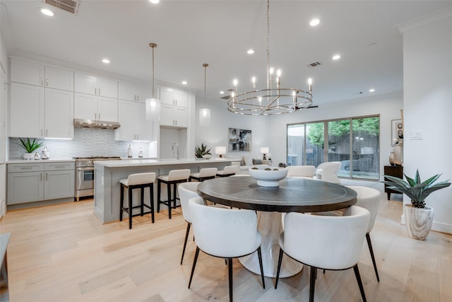 626 E 14th St, Houston, TX 77008 - dining room with a chandelier, light wood-style flooring, and recessed lighting