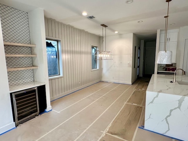 626 E 14th St, Houston, TX 77008 - unfurnished dining area featuring wine cooler, a sink, a chandelier, and recessed lighting