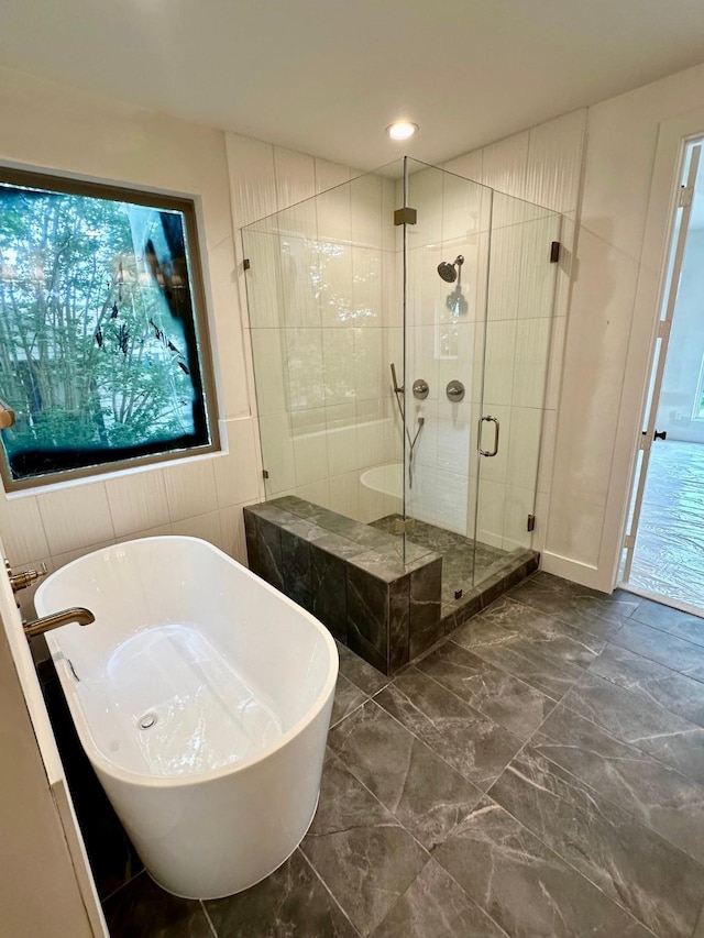 626 E 14th St, Houston, TX 77008 - bathroom featuring a shower stall and a soaking tub