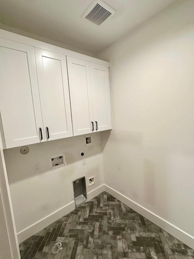 626 E 14th St, Houston, TX 77008 - washroom featuring cabinet space, electric dryer hookup, hookup for a gas dryer, baseboards, and hookup for a washing machine