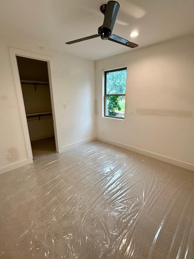 626 E 14th St, Houston, TX 77008 - unfurnished bedroom featuring baseboards, a spacious closet, a ceiling fan, and a closet