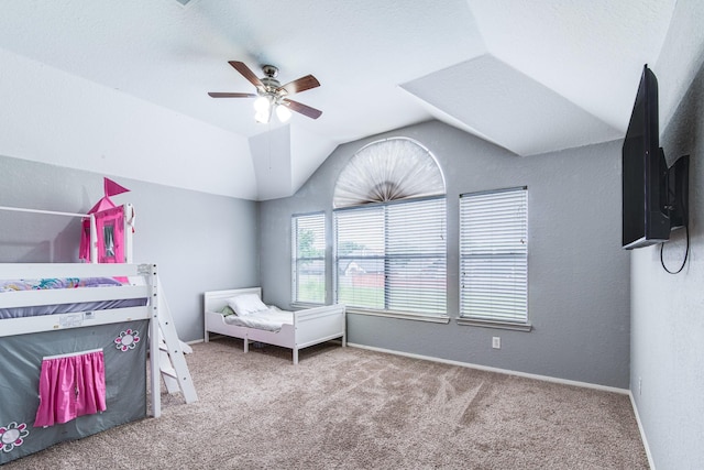 231 Spencer Lndg E, La Porte, TX 77571 - carpeted bedroom with vaulted ceiling, baseboards, and ceiling fan