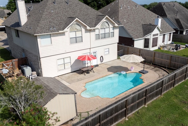 231 Spencer Lndg E, La Porte, TX 77571 - view of pool with a patio area and a fenced backyard
