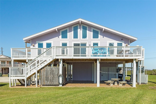 4406 Tampico Way, Galveston, TX 77554 - back of house with a lawn, stairs, a deck, and a carport