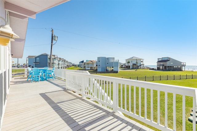 4406 Tampico Way, Galveston, TX 77554 - wooden deck featuring outdoor dining space and a yard