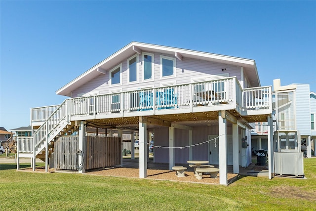 4406 Tampico Way, Galveston, TX 77554 - rear view of property with a lawn, stairs, a deck, and a carport
