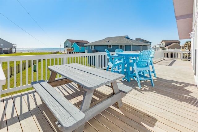 4406 Tampico Way, Galveston, TX 77554 - wooden deck with outdoor dining area and a yard