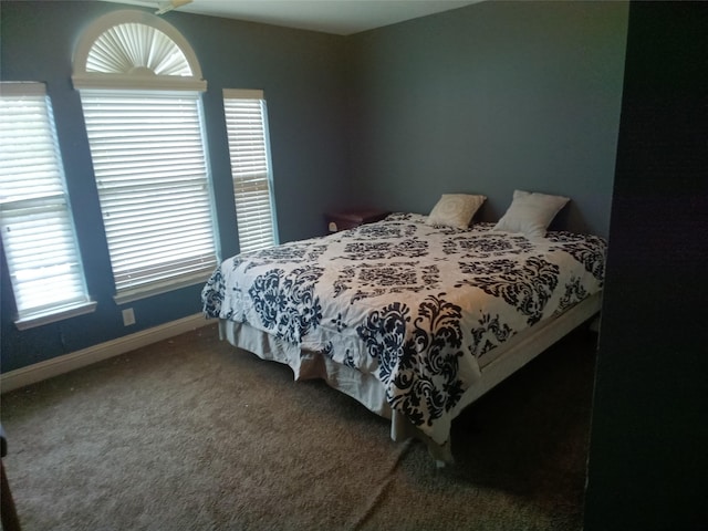 bedroom with carpet and baseboards