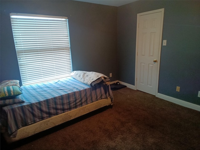 carpeted bedroom with baseboards