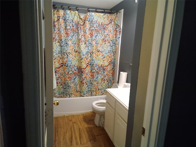 bathroom with toilet, shower / bath combo, and vanity