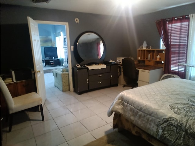 bedroom featuring light tile patterned flooring
