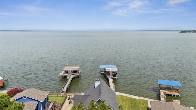 dock area with a gazebo and a water view