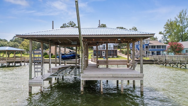 view of dock featuring a water view and boat lift