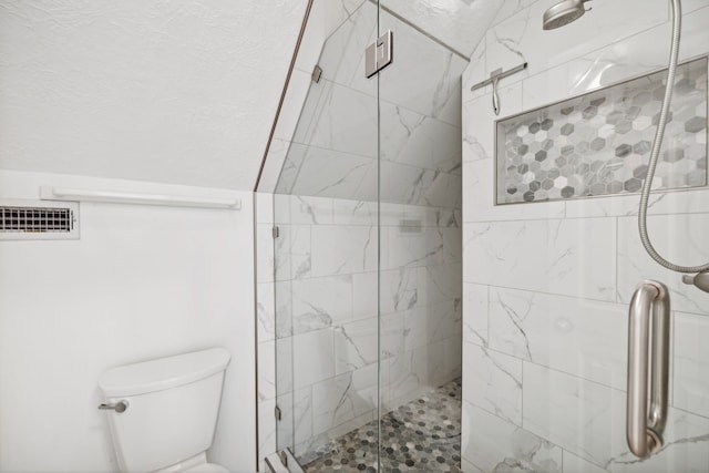 full bath featuring toilet, visible vents, and a marble finish shower