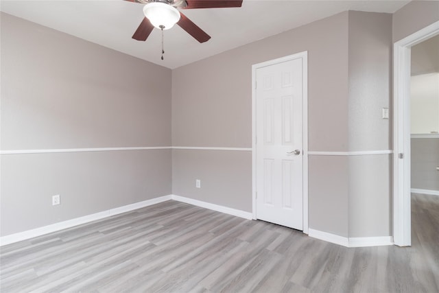 unfurnished bedroom with baseboards, ceiling fan, and wood finished floors
