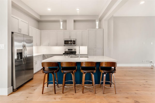 1033 Roberts St, Houston, TX 77003 - kitchen with appliances with stainless steel finishes, light countertops, light wood-style floors, and recessed lighting