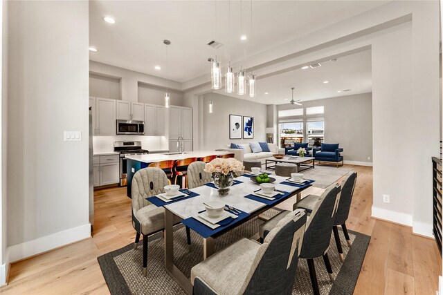 1033 Roberts St, Houston, TX 77003 - dining space featuring baseboards, light wood finished floors, and recessed lighting