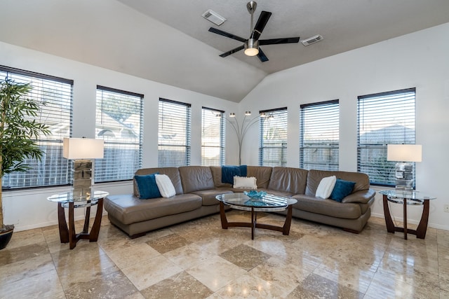 living area with baseboards, visible vents, ceiling fan, and lofted ceiling