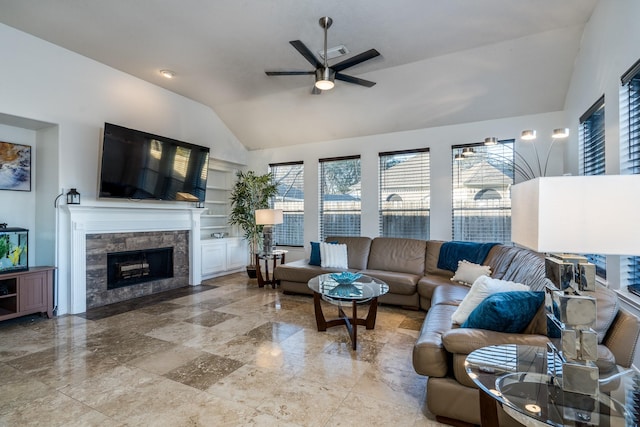 living room featuring a fireplace, lofted ceiling, and ceiling fan