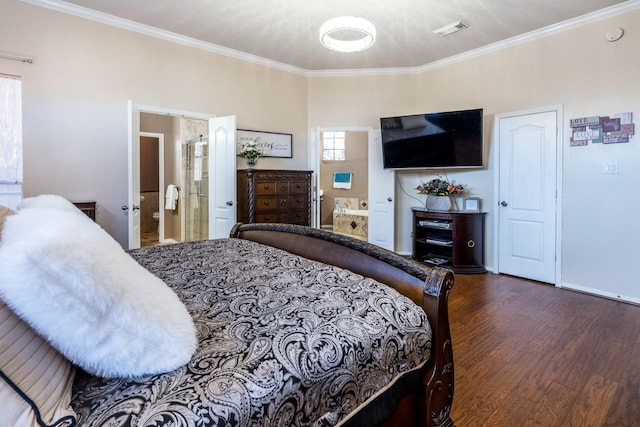bedroom with ensuite bathroom, visible vents, crown molding, and wood finished floors