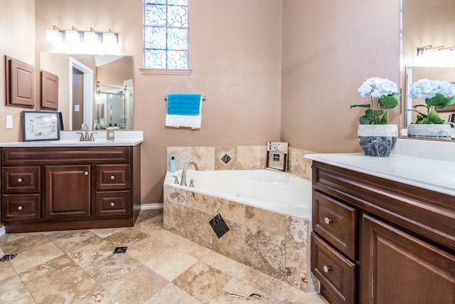 full bath with a bath, vanity, and a shower stall