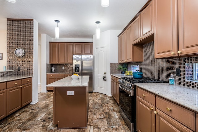 kitchen featuring stainless steel appliances, a center island, decorative backsplash, hanging light fixtures, and light stone counters