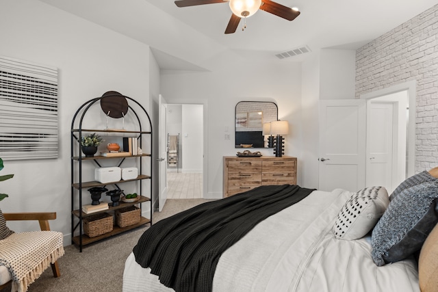 bedroom featuring brick wall, visible vents, ceiling fan, and carpet floors
